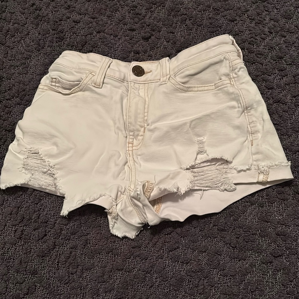 White shorts with rips